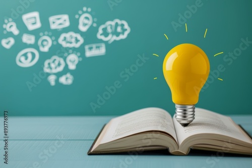 A book with lightbulb and drawings of ideas on the background photo