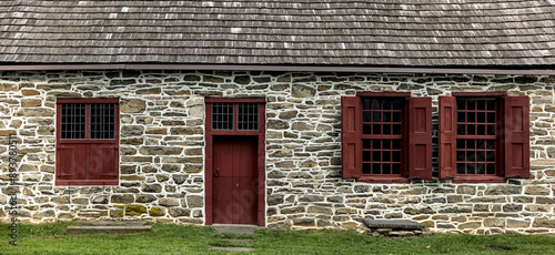Fotografie window and door details in stone home (old historic architecture from colonial p