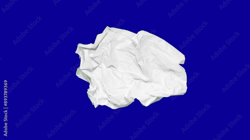 Stop motion animation of crumpled pape on a blue background. High quality 4k footage
