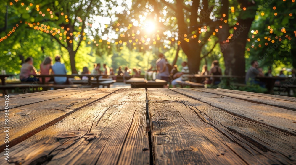 Rustic Wooden Tabletop with Blurred Background of People Enjoying a Sunny Day in a Garden Rustic Wooden Tabletop with Blurred Background of People Enjoying a Sunny Day in a Garden