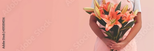 Elegant Bouquet of Lilies against a Soft Pink Background - A woman holding a vibrant bouquet of peach lilies, symbolizing beauty, love, nature, celebration, and serenity in a soft pink setting.