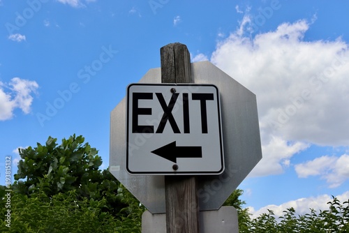 A close view of the black and white exit sign.