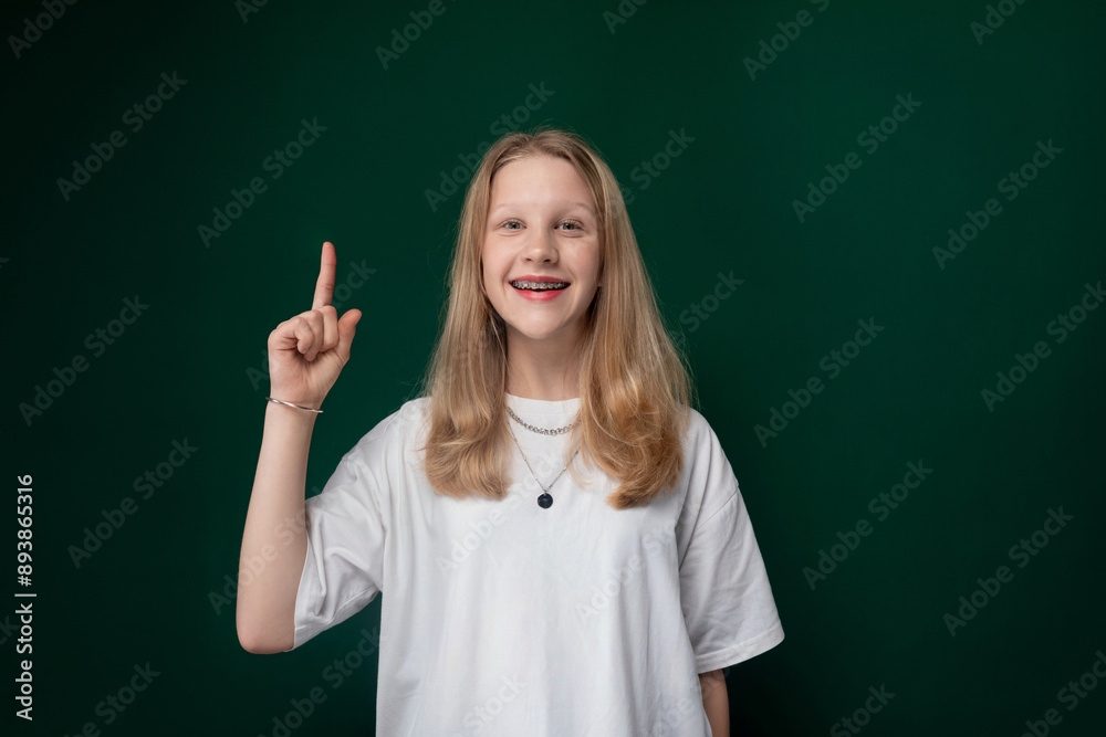 Girl in White T-Shirt Pointing at Camera Girl in White T-Shirt Pointing at Camera