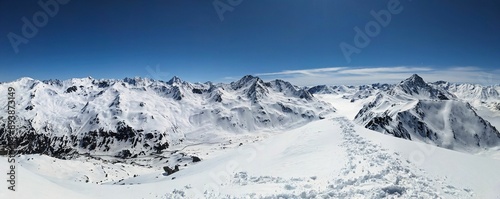 Ski tour on the mountains Baslersch Chopf and Sentisch Horn in the Davos Klosters mountains above the Flüela Pass. Ski mountaineering on a sunny, beautiful winter day. Skimo. High quality photo. photo