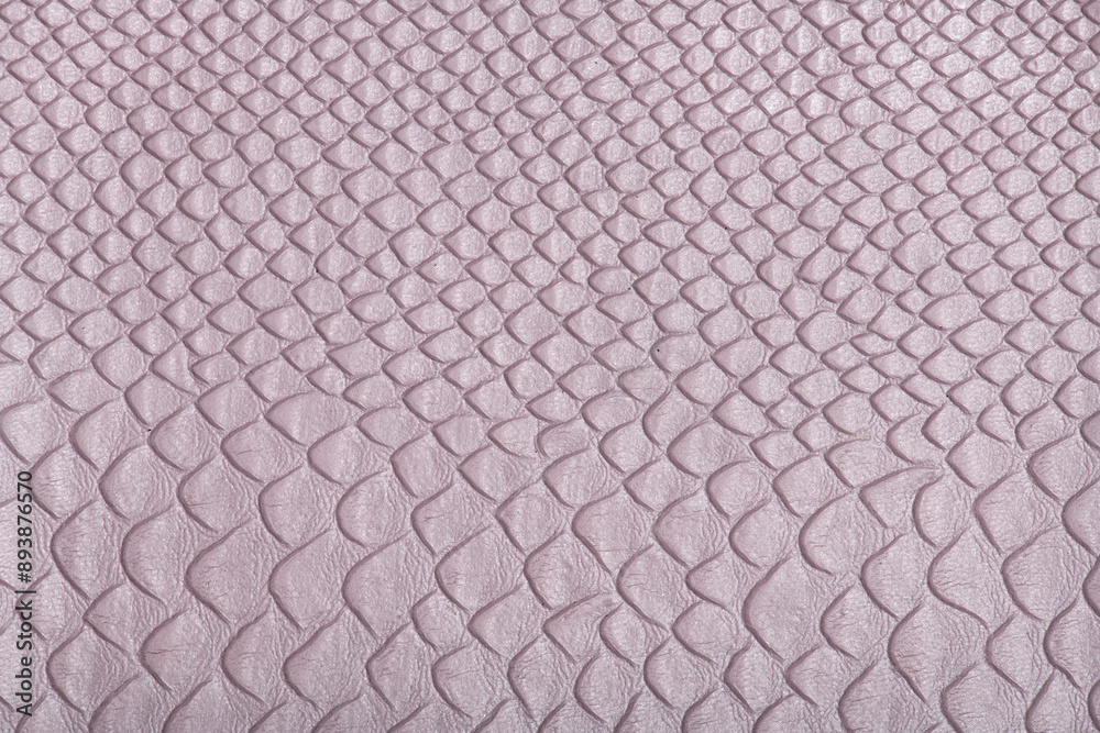 Close up photo of a pink synthetic fabric with snake skin effect