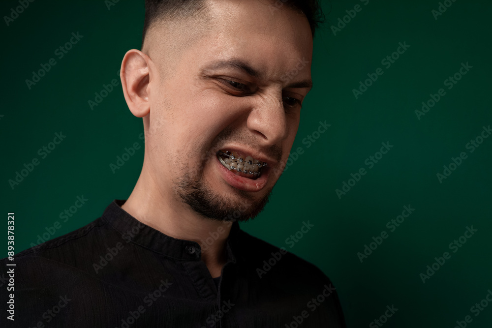 Man With Braces in Black Shirt Man With Braces in Black Shirt