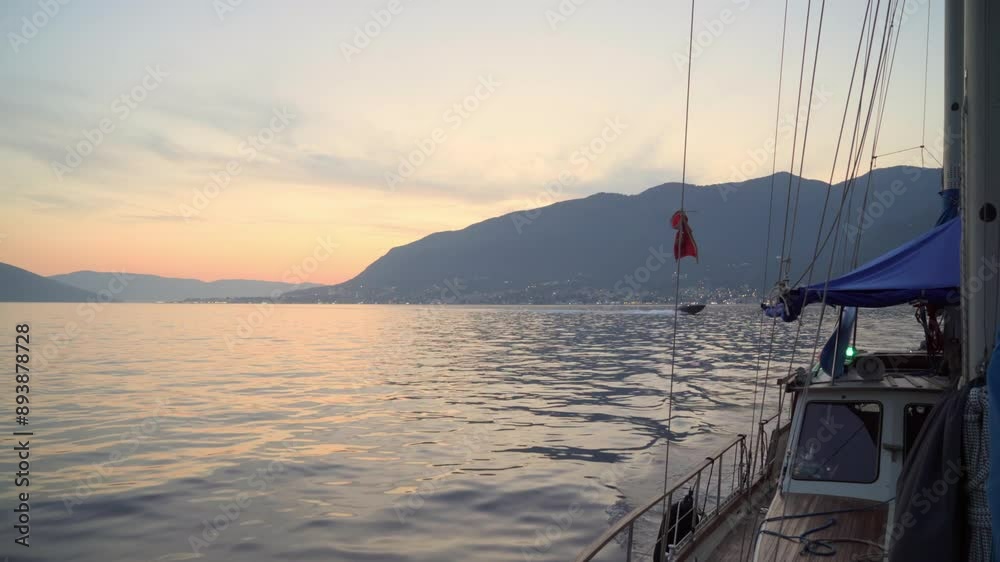 Bay of Kotor, Montenegro. View of the sea and mountains from a sailing yacht at sunset Bay of Kotor, Montenegro. View of the sea and mountains from a sailing yacht at sunset