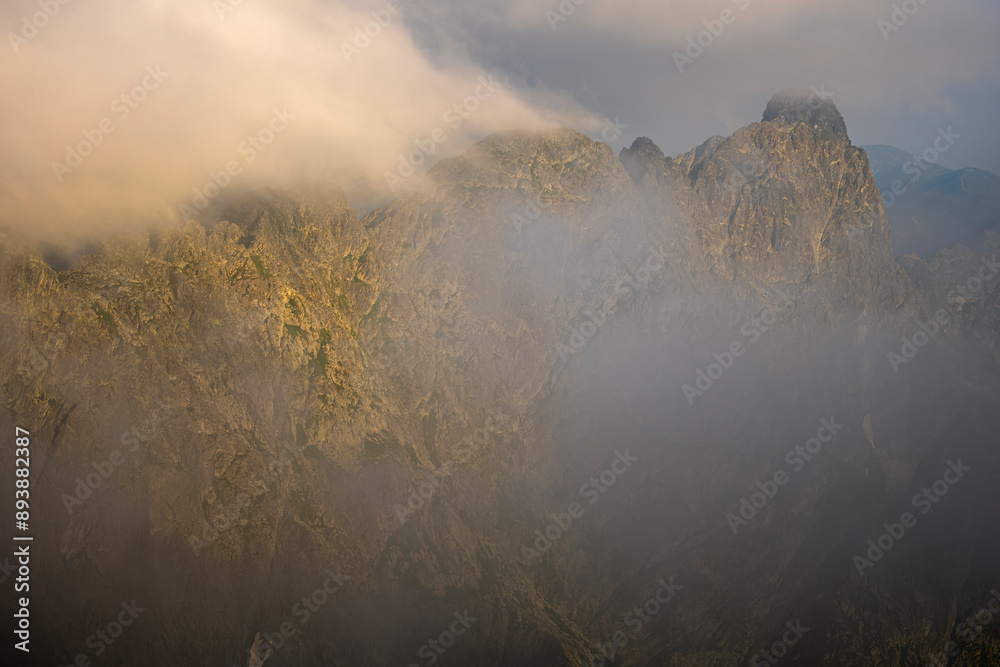 Fototapeta premium Dramatic sunrise over the Tatra Mountains. The Mieguszowieckie Peaks.
