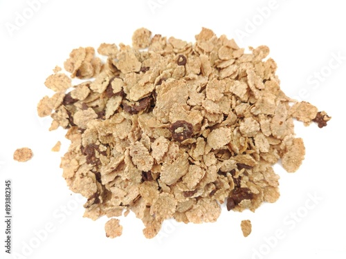 Top view of a heap of rice and wheat flakes with dark chocolate bits, isolated on white background. photo