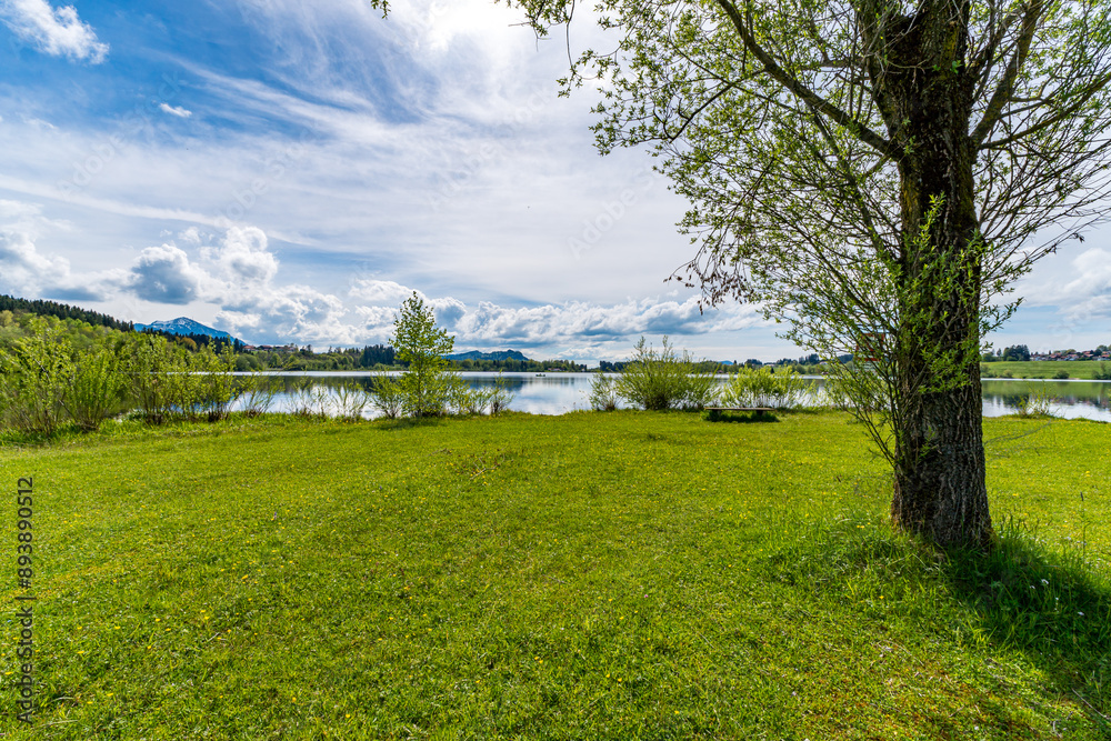 Leisurely hike in early summer at Rottachsee in the Allgau Leisurely hike in early summer at Rottachsee in the Allgau