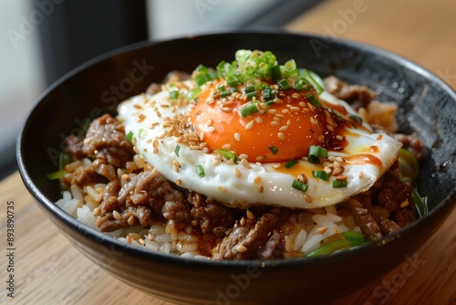 Enjoy a satisfying lunch with our flavorful Beef Donburi topped with a perfectly cooked sunny side up egg - generative ai