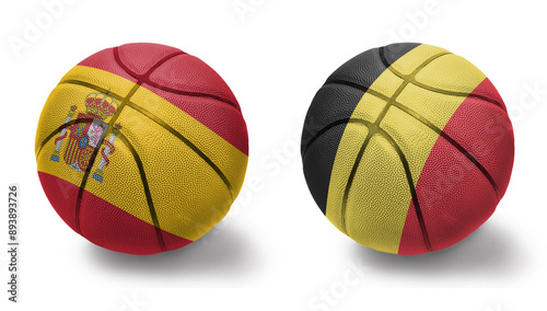 basketball balls with the national flags of belgium and spain on the white background.