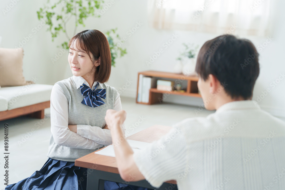 Obraz premium 成績が悪くて親に怒られる高校生.