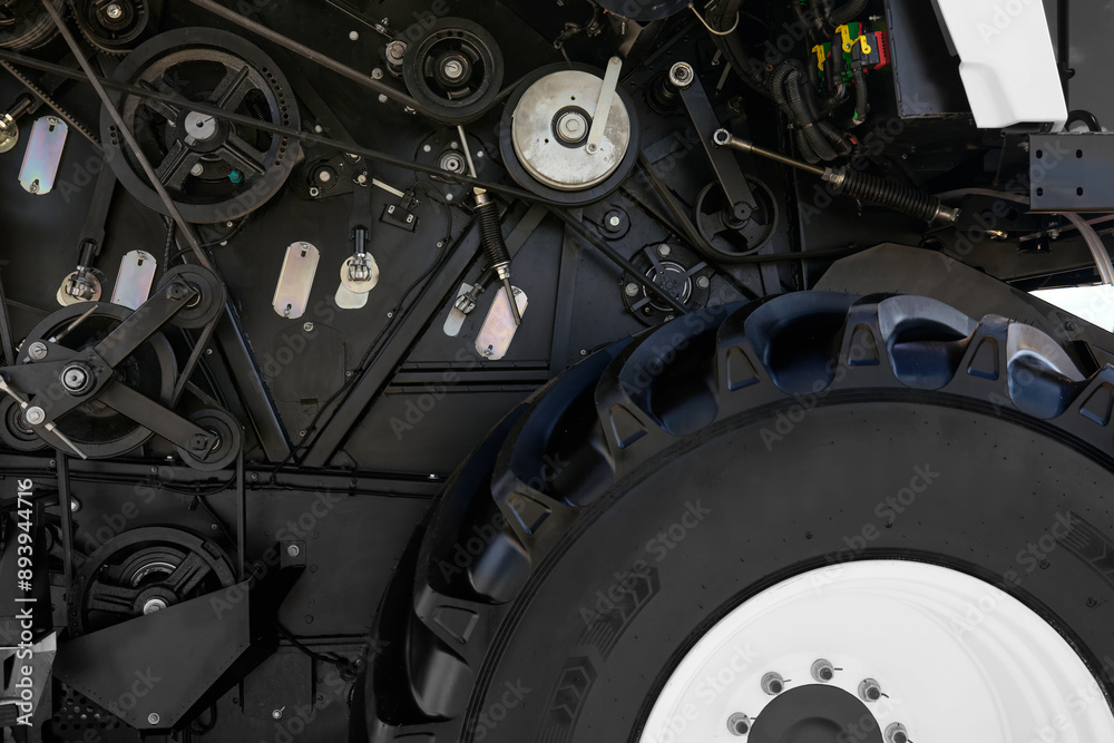 Close-up of the controls engine and the mechanisms of a modern harvester. Close-up of the controls engine and the mechanisms of a modern harvester.