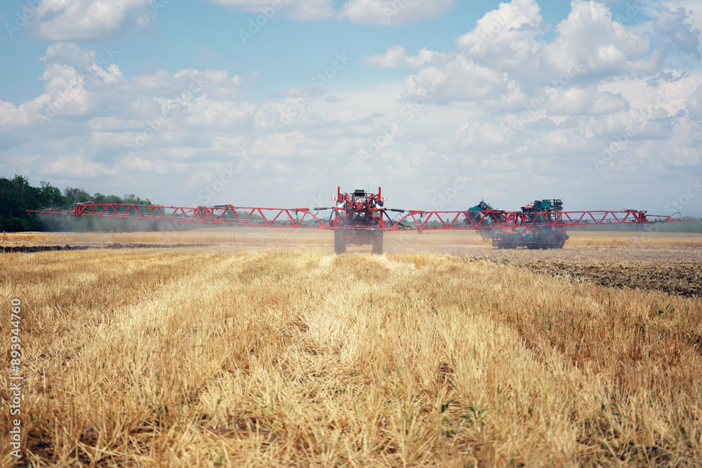 Fototapeta premium Rear view of agricultural equipment for spraying fertilizers and water in the fields.