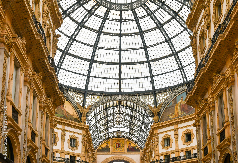 Obraz premium Low-angle view of the iron and glass dome of the Galleria Vittorio Emanuele II historic shopping gallery, Milan, Lombardy, Italy