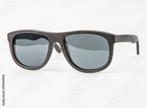 Dark Brown Solar bamboo sunglasses wood isolated on white background with shadow