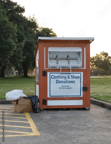 Clothing and shoe donation bin charity recycle reuse donate community. photo