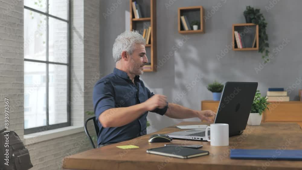 man working at computer takes break does physical activity in front of laptop screen,person sits at the desk in home office taking pause from work to do healthy routine of exercises man working at computer takes break does physical activity in front of laptop screen,person sits at the desk in home office taking pause from work to do healthy routine of exercises