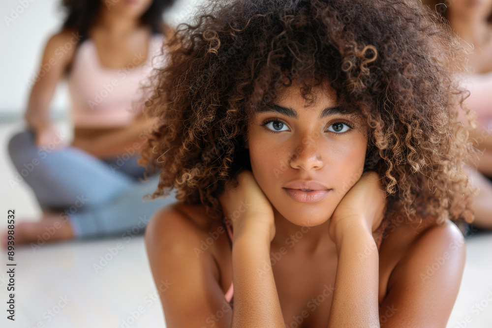 Young Woman with Curly Hair in Yoga Class Young Woman with Curly Hair in Yoga Class