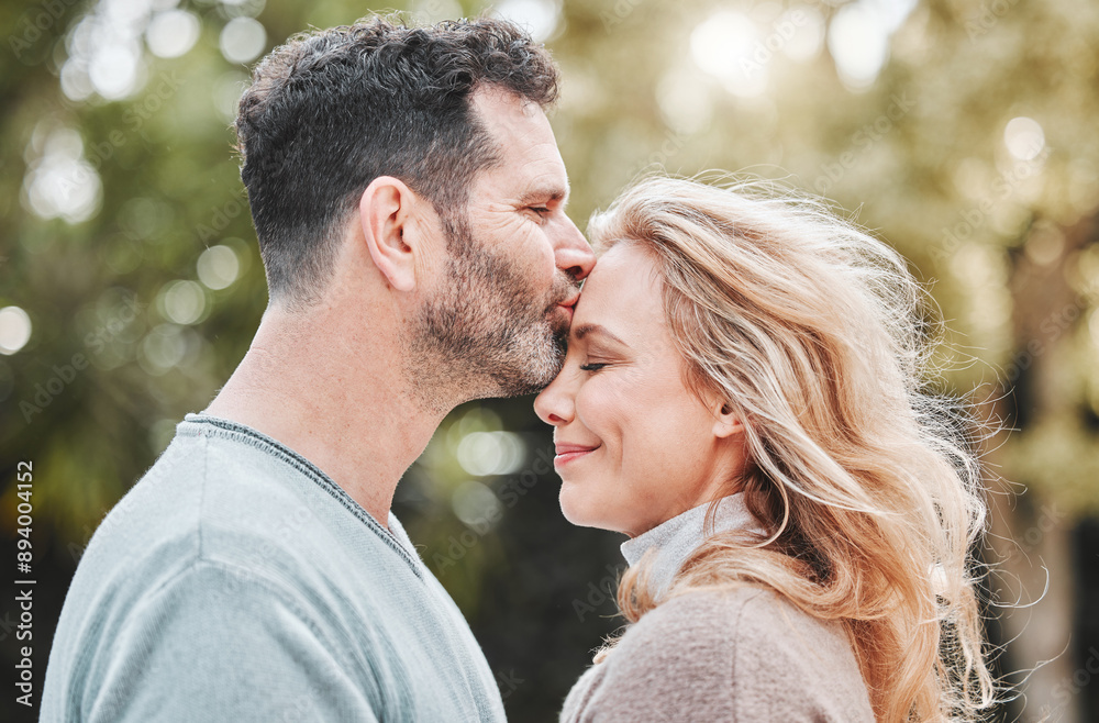 Mature couple, forehead kiss and nature for support, love and affection for spouse on holiday. Happy people, profile and vacation for bonding on travel, trust and countryside security in commitment Mature couple, forehead kiss and nature for support, love and affection for spouse on holiday. Happy people, profile and vacation for bonding on travel, trust and countryside security in commitment