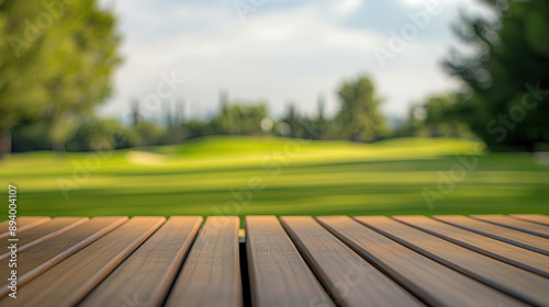Wallpaper Mural close up of empty wooden table with blurred golf course court background Torontodigital.ca
