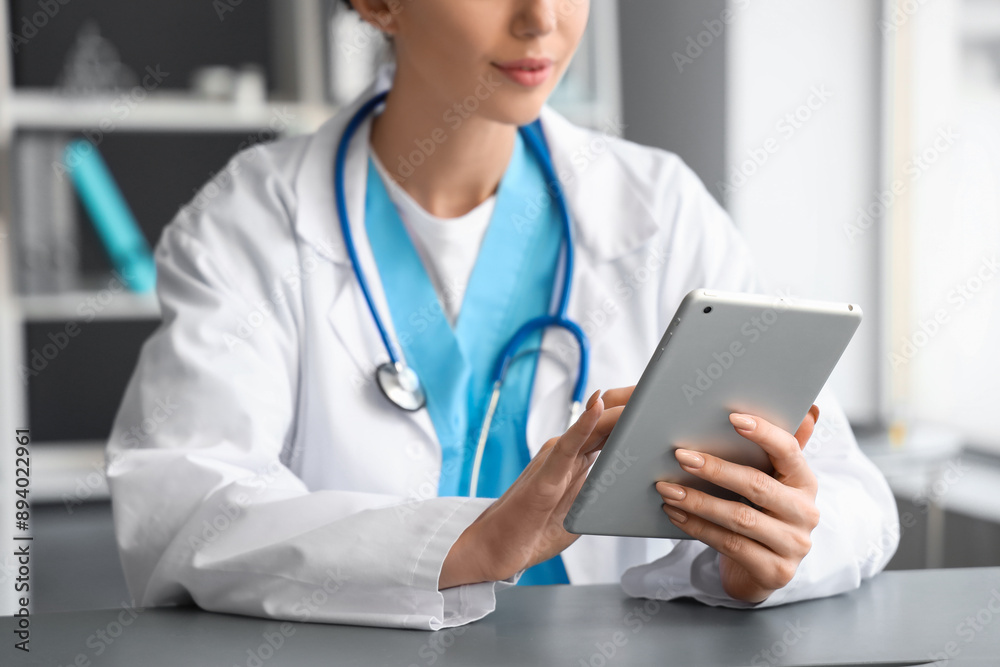 Female doctor using tablet computer in office, closeup Female doctor using tablet computer in office, closeup