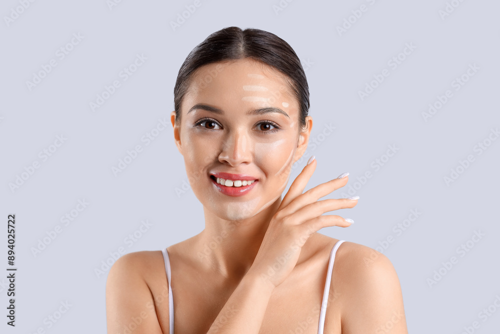 Young Asian woman with contouring on light background, closeup Young Asian woman with contouring on light background, closeup