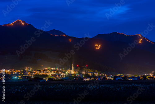 Traditional mountain bonfires for the summer solstice in the Tiroler Zugspitz Arena near Ehrwald