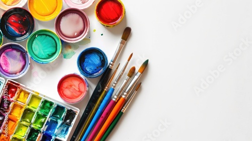 Watercolor and art supplies on white background Artist workspace top view copy space