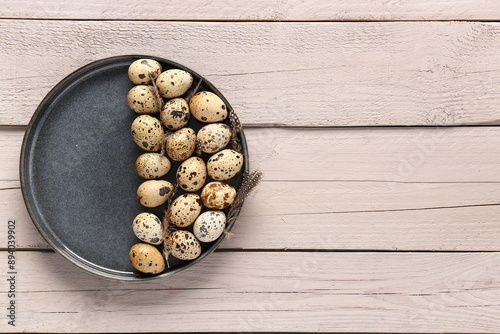 Fresh quail eggs on dark pl...
