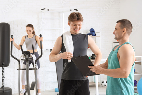 Male trainer with clipboard...
