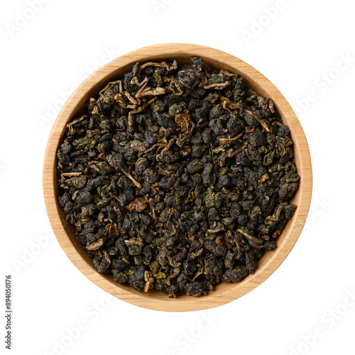 Dried Oolong tea leaves in wooden bowl, Top view