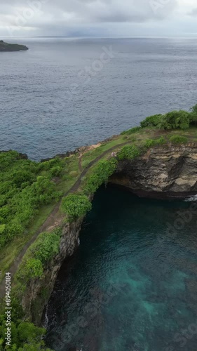 Aerial video of a broken beach, in Bali, Indonesia photo