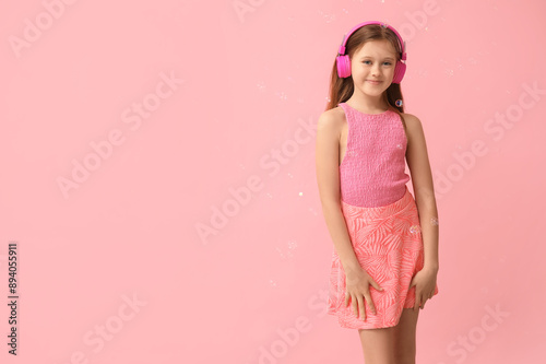 Cute girl in headphones wit...