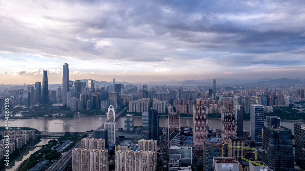 Fototapeta premium Stunning Aerial View of a Modern City Skyline at Sunset