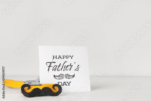 Pliers, paper mustache and ...