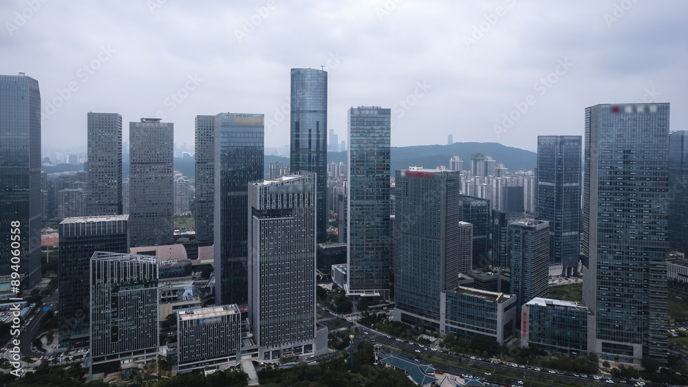 Aerial View of Modern Urban Skyline with Skyscrapers Under Cloudy Sky Aerial View of Modern Urban Skyline with Skyscrapers Under Cloudy Sky