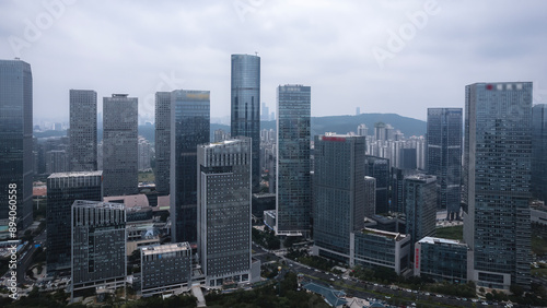 Aerial View of Modern Urban Skyline with Skyscrapers Under Cloudy Sky