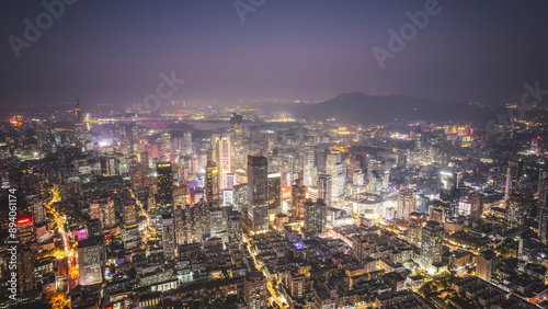 Fototapeta Naklejka Na Ścianę i Meble -  Stunning Aerial View of a Vibrant Metropolitan City at Night