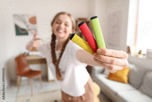Young woman pointing at dif...