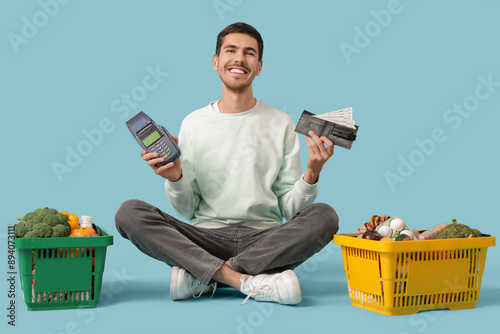 Young man with wallet, paym...