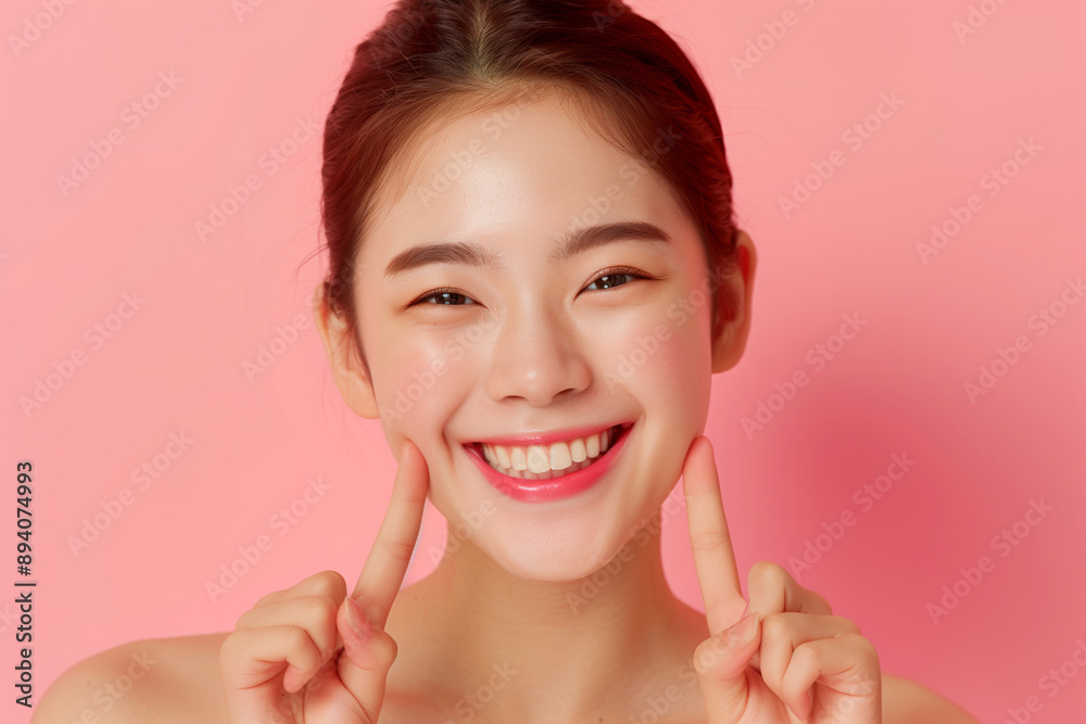 Smiling asian female model with glowing face