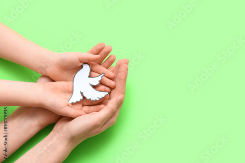 Child's and female hands wi...