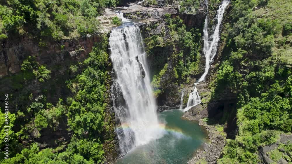 Stunning aerial view of Lisbon Falls cascading into a serene pool in lush South Africa