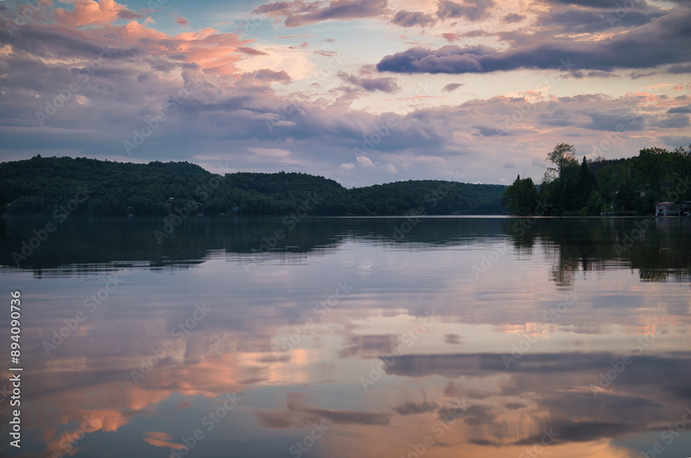 Fototapeta premium Colorful sunset on a lake with reflection