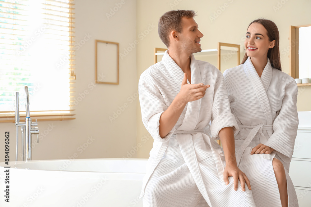 Young couple chatting after shower in bathroom Young couple chatting after shower in bathroom
