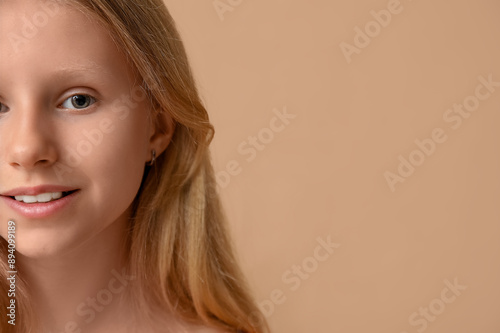 Teenage girl on beige backg...
