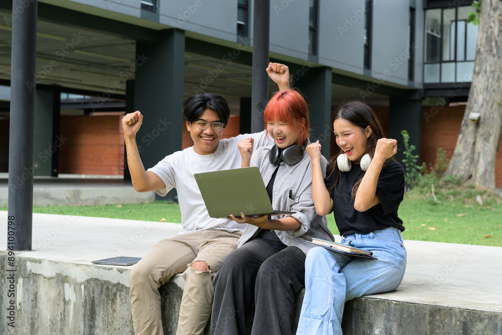 © Parichat - Group of Happy Students Celebrating Success Outdoors with Laptop at Modern Campus © Parichat - Group of Happy Students Celebrating Success Outdoors with Laptop at Modern Campus