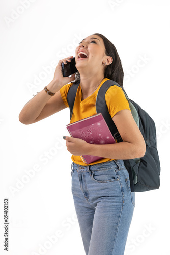 Latina Student Laughing and Talking on the Phone with Backpack and Notebook